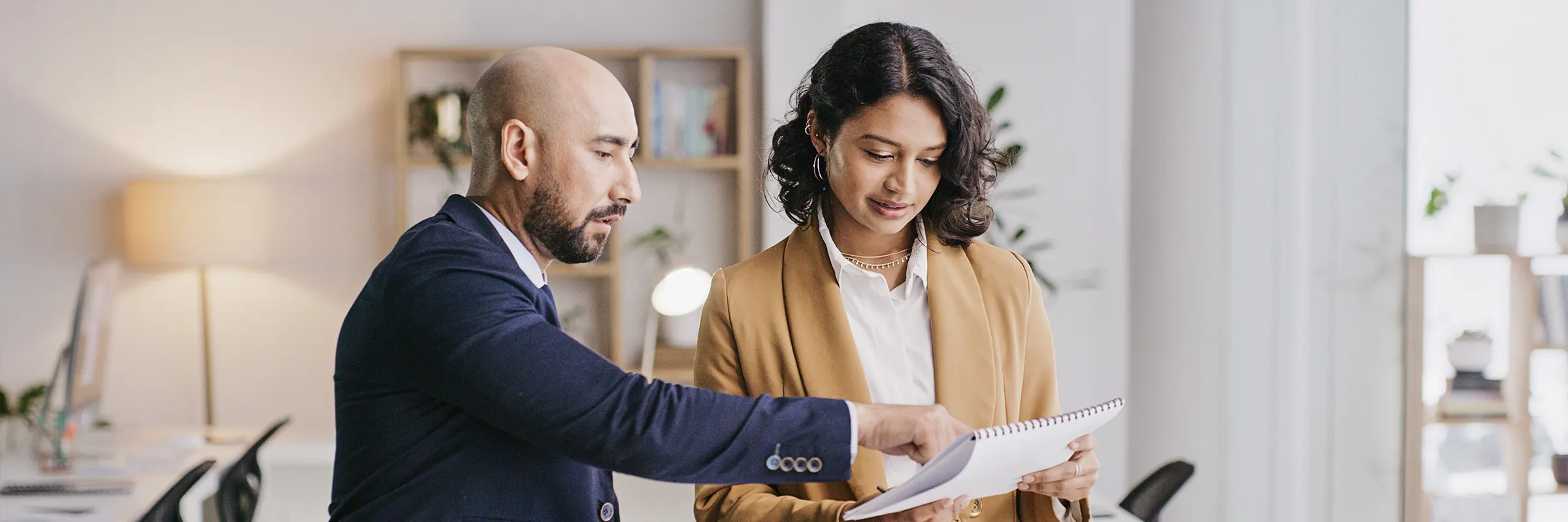 A man and woman looking at documents.