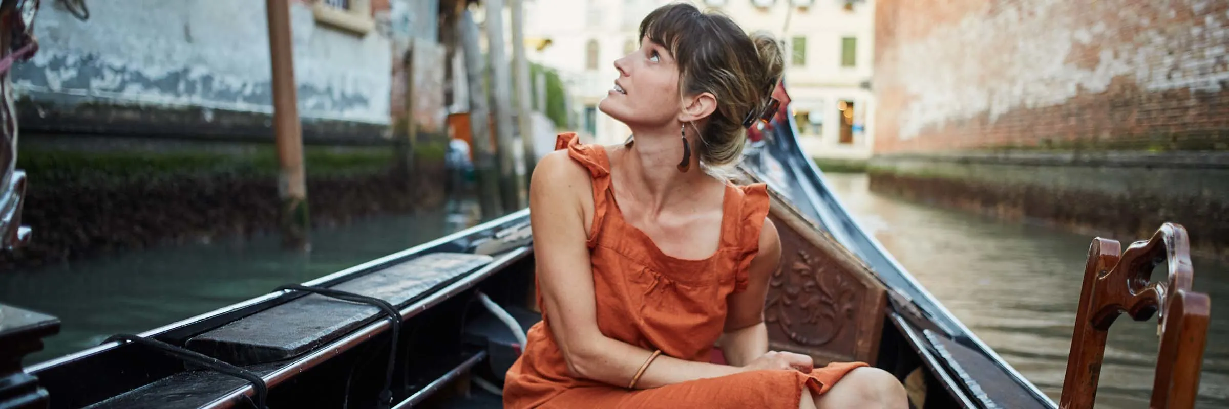 woman on vacation sitting in a gondola