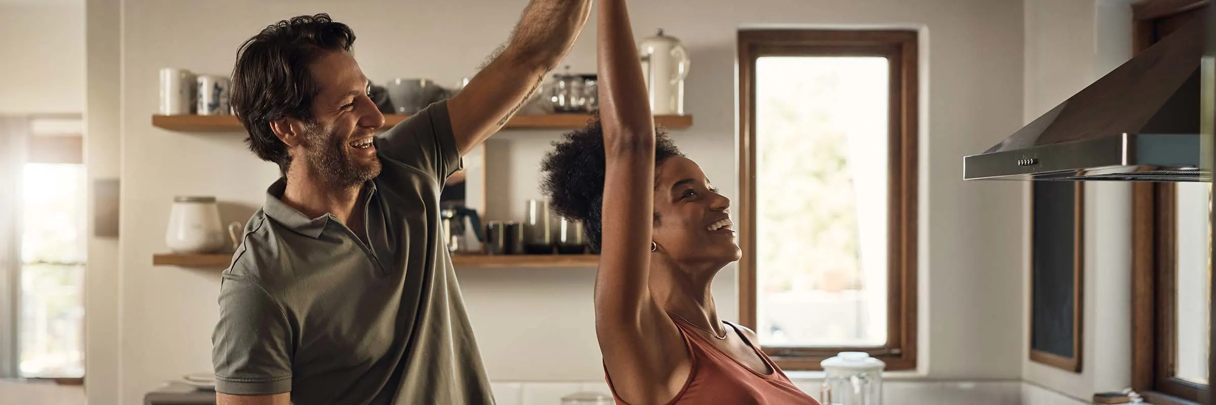 Couple dancing in their kitchen