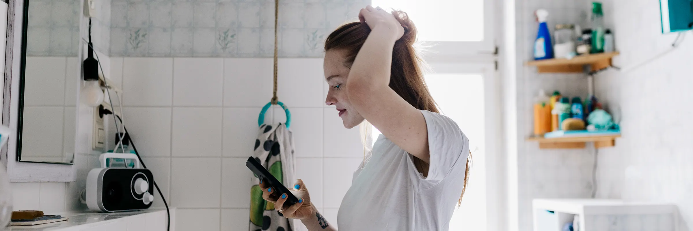 A woman checks her portfolio while getting ready for the day.