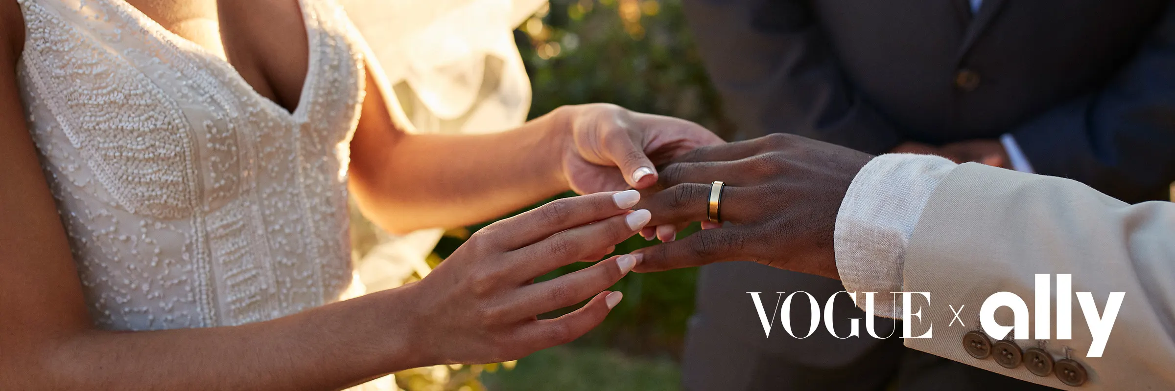 Young bride exchanging wedding ring with groom