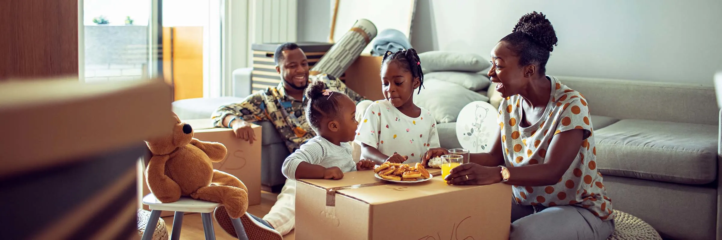 family having breakfast in their new home