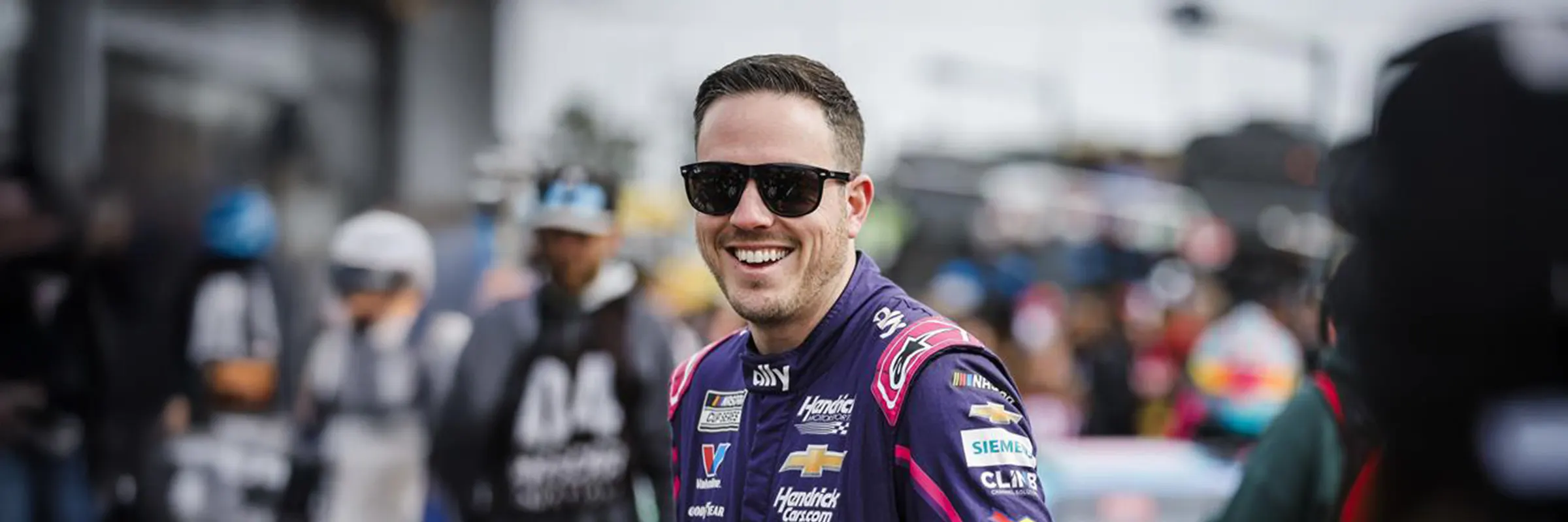 Alex Bowman, driver of Hendrick's #48 racecar smiles to fans at Daytona.