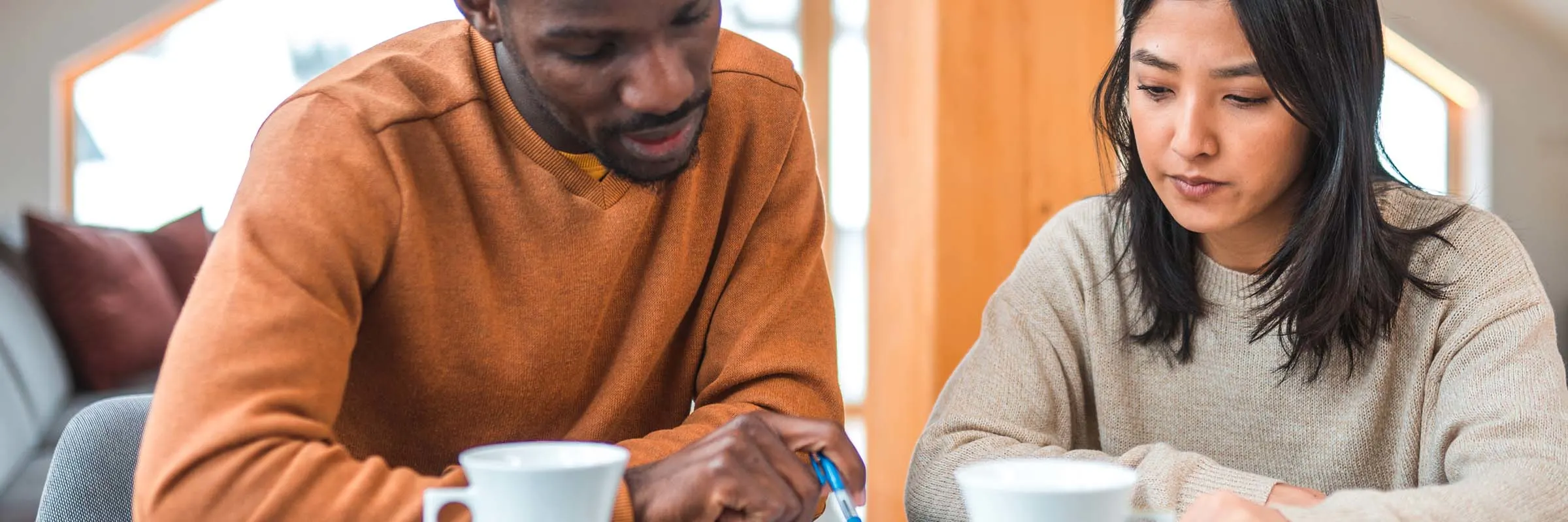 a young couple reviewing their finances 