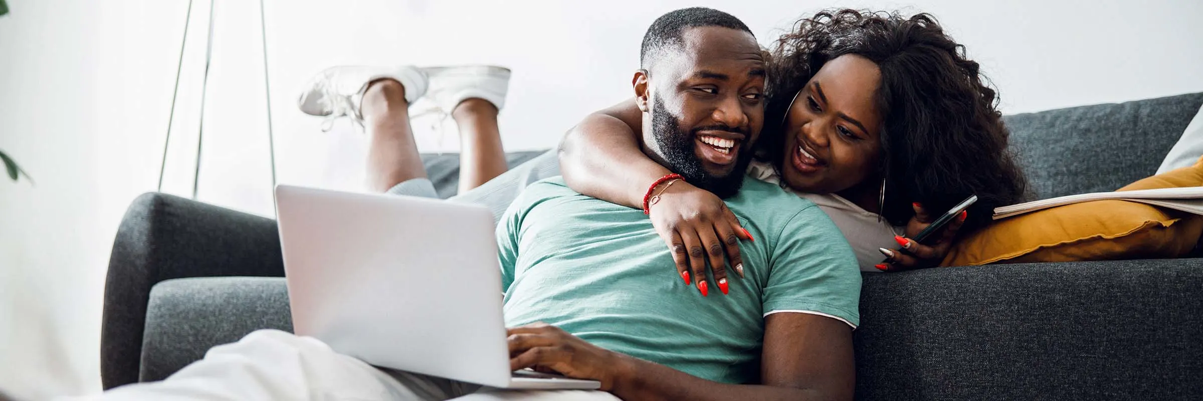  A couple looks over their investment accounts at home on a laptop.