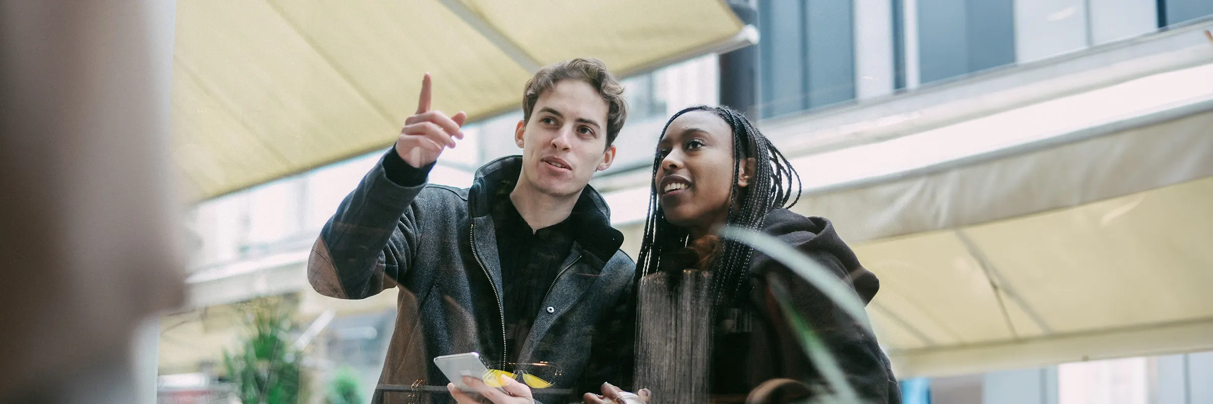  A couple window shopping in a city.