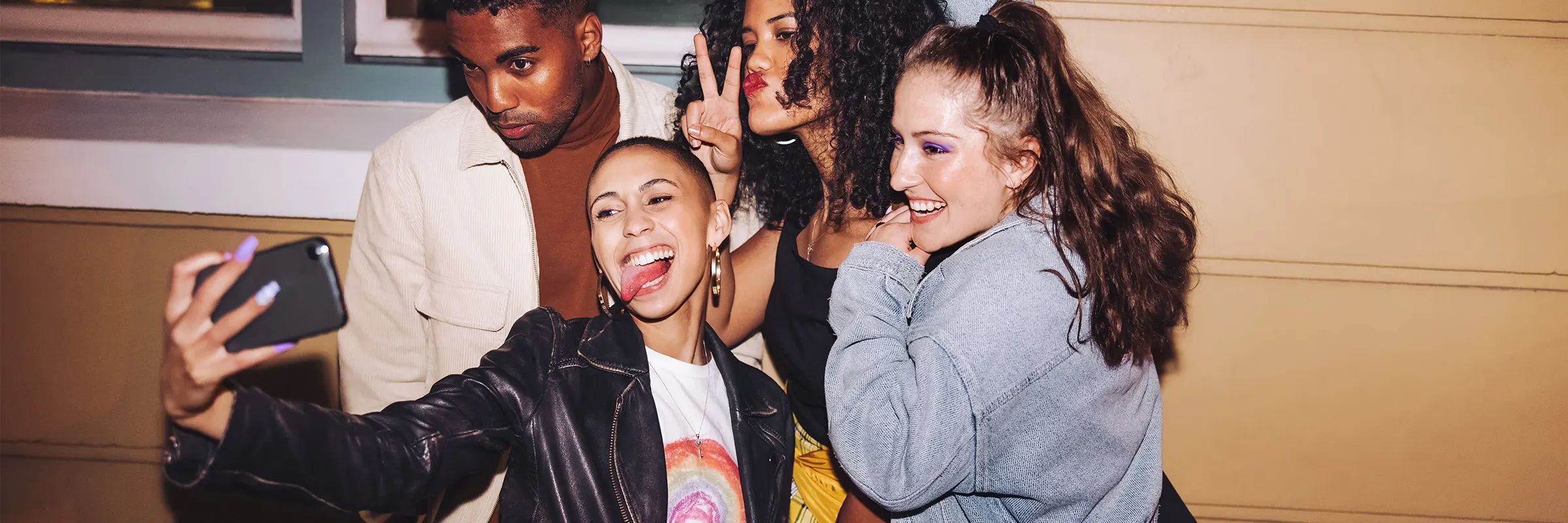 Four friends posing for a selfie. 