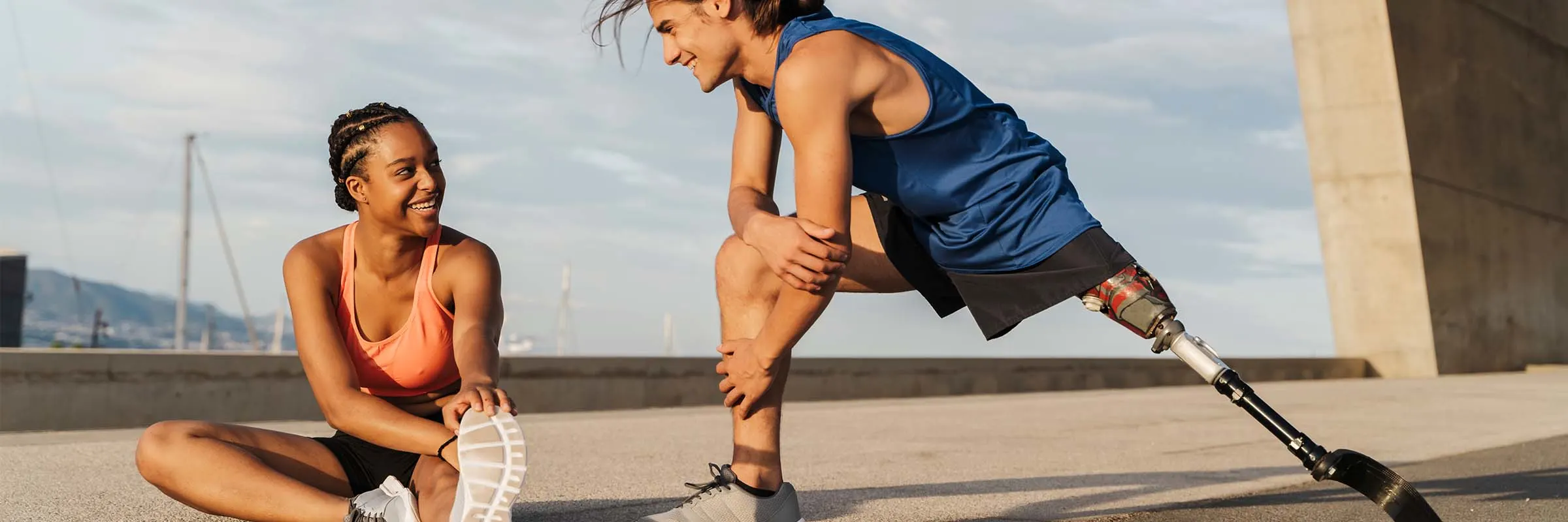 Two runner stretch before going on a run outside.