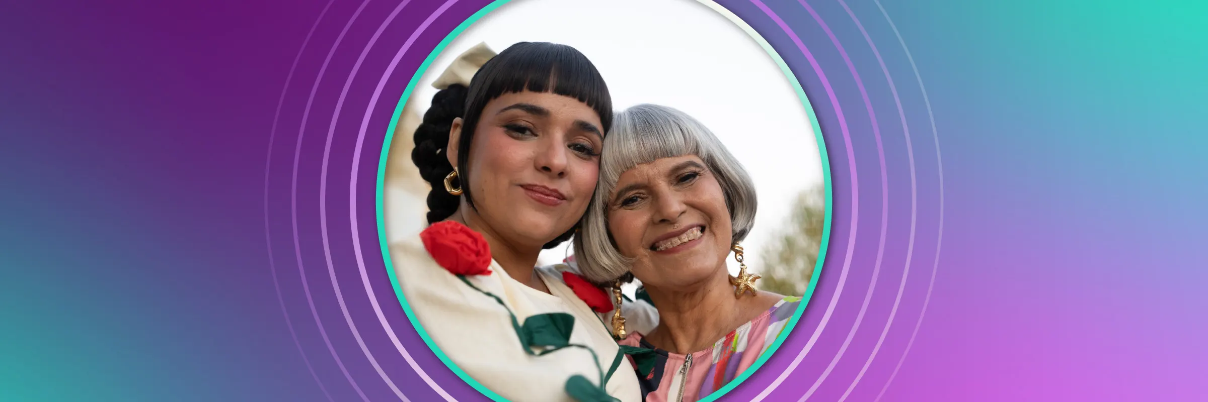 Jarina De Marco and her mother hug while smiling into the camera. 