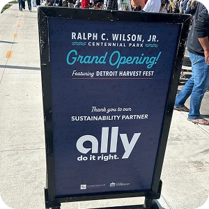 A sign at the grand opening of Ralph C. Wilson, Jr. Centennial Park thanking Ally as the sustainability sponsor