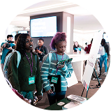 two young girls seeking information at a Fueling Futures event.