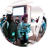 two young girls seeking information at a Fueling Futures event.