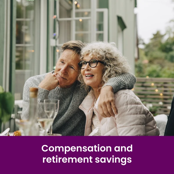 an older man with his arm around an older woman sitting outside at a table on a restaurant patio