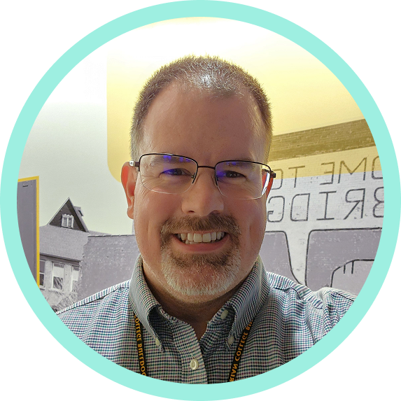 Headshot of Greg Bisson.