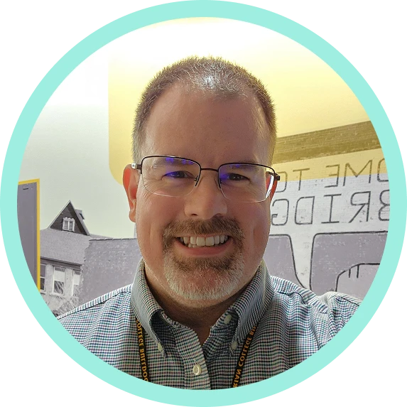 Headshot of Greg Bisson.