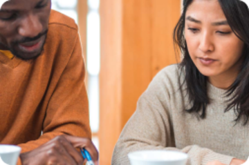 Two people at a table.