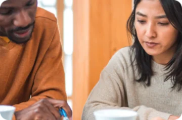 Two people at a table.